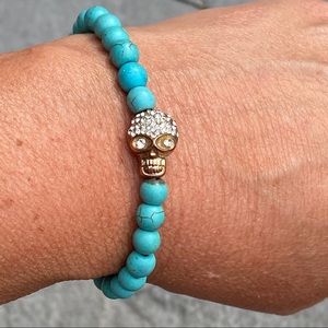 Turquoise color bead and copper sugar skull stretch bracelet